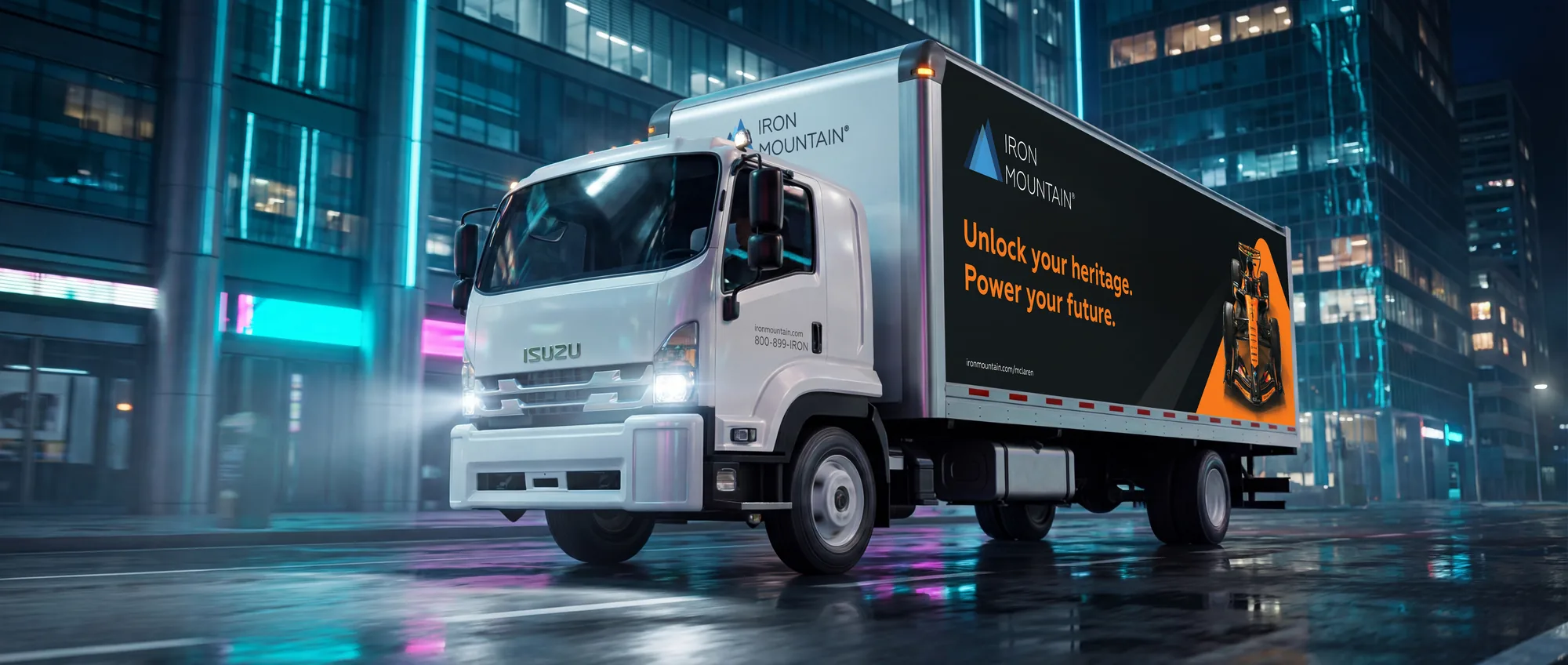 Iron Mountain McLaren truck on a wet downtown Miami street at night
